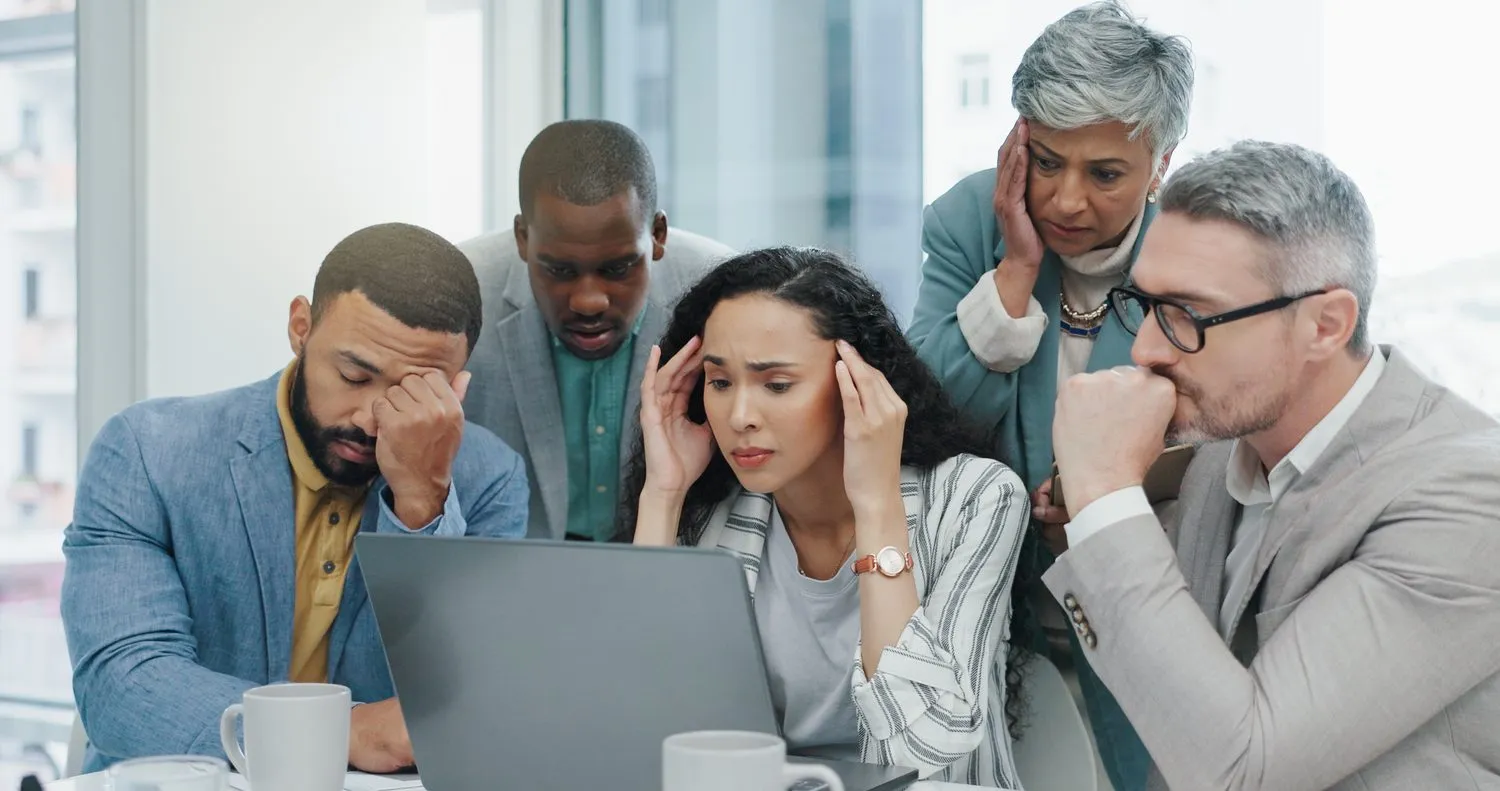 Stressed colleagues working together at the office