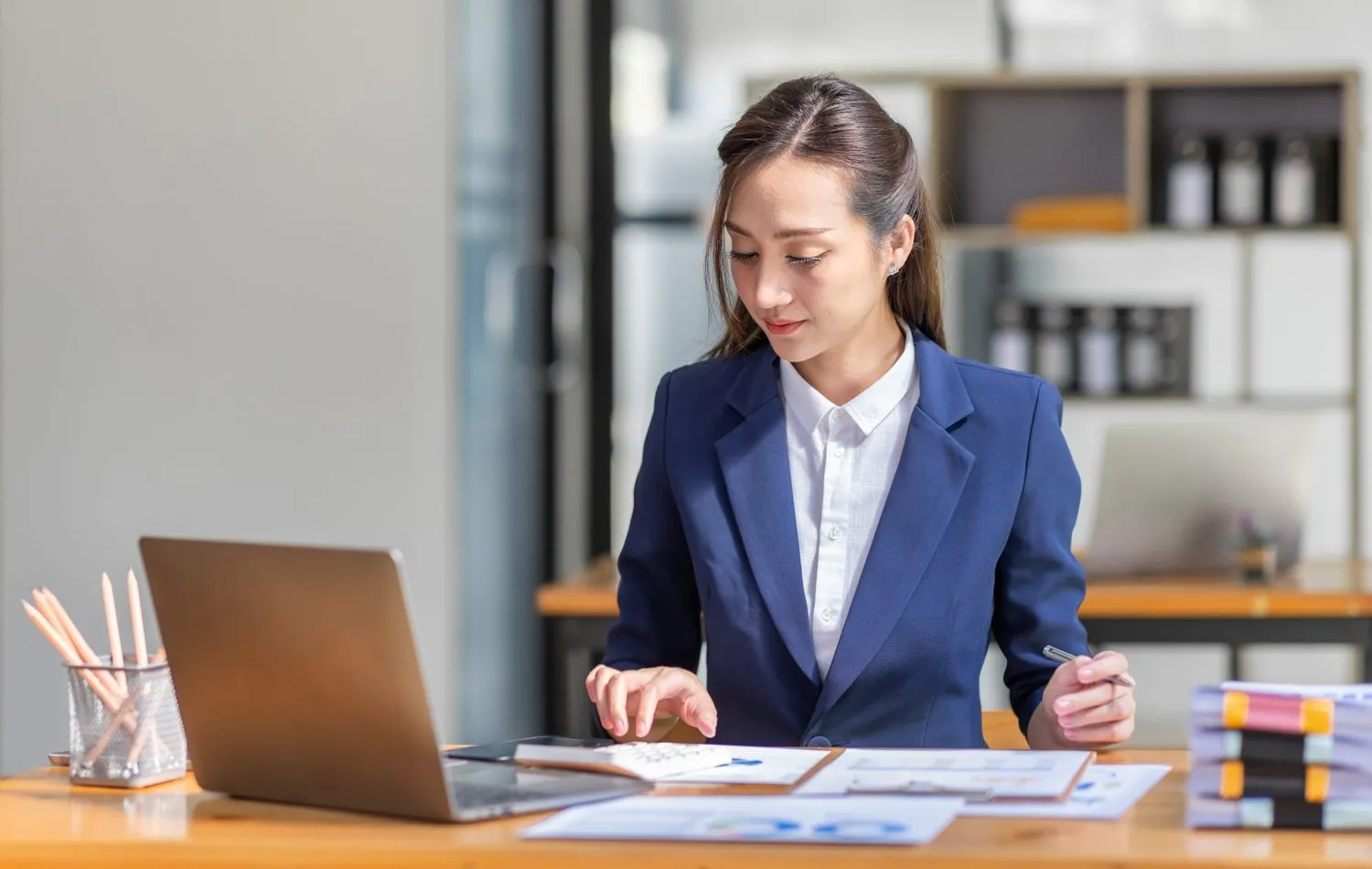 A solicitor setting up a new practice at her desk
